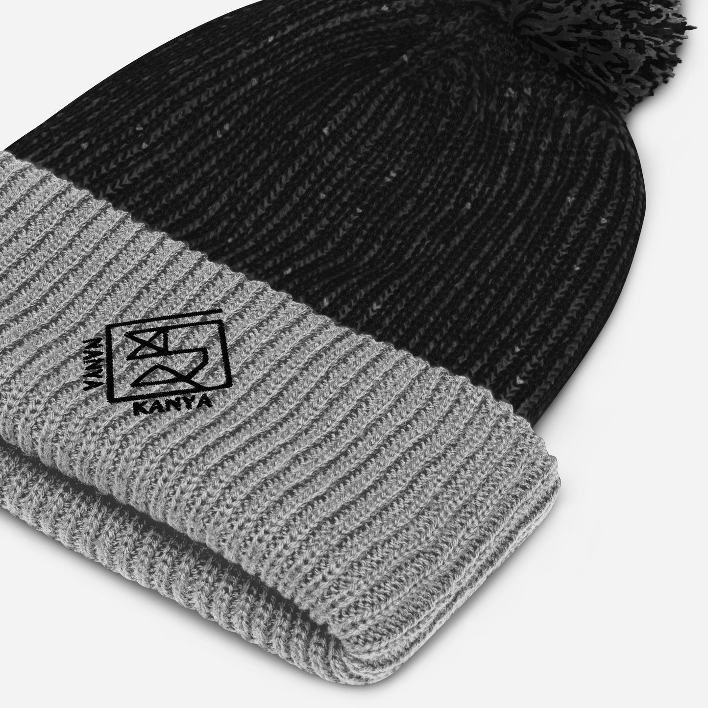 Reverse sponsored knit hat with pompom